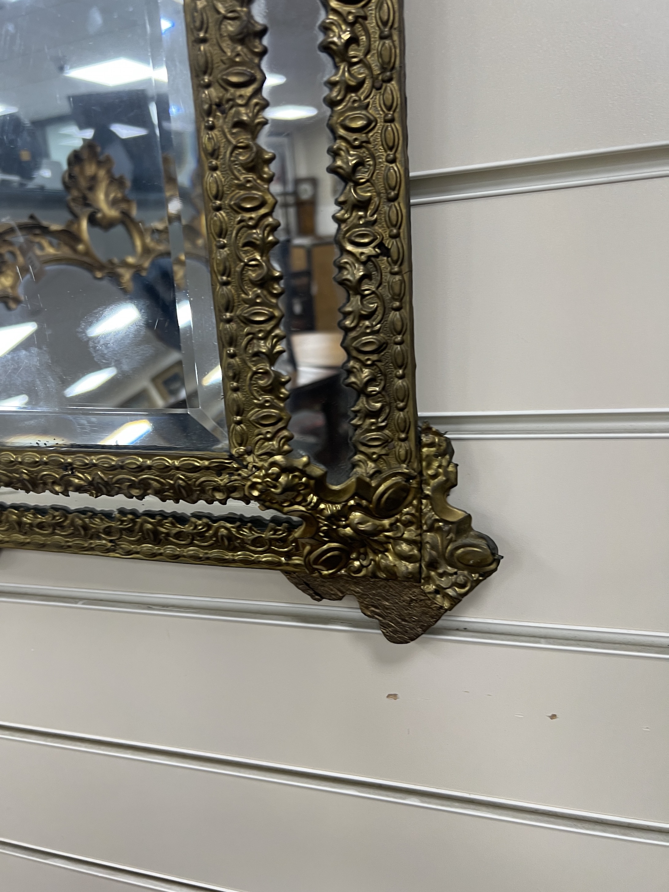A 19th century French embossed brass wall mirror, width 39cm, height 54cm
